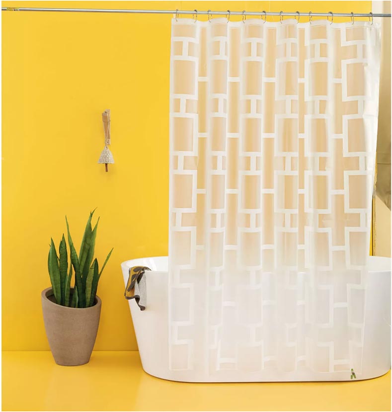 frosted clear breezeblock shower curtain in a yellow bathroom with a modern tub. perfect for a mid century modern bathroom upgrade in a weekend