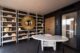 An office with bookshelves and a quartz desk