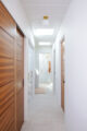 hallway storage leading to bathroom in renovated Eichler