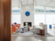 Palm Springs living room with coral, blue and white furniture