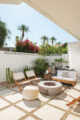 firepit and white and cream outdoor furniture and desert landscaping