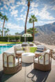 backyard with pool, pergola and lounge chairs