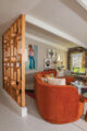 wooden room divider and rust colored sofa in 1957 Charles Du Bois home