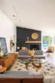 Noguchi table and black accent wall with fireplace in bright renovated Rossmoor home