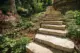 limestone stairs leading down to fire pit in Wisconsin backyard