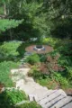 limestone stairs leading down to fire pit in MCM landscaping