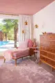 pink settee and rug with view to pool in Vivan suite of Johnny Cash's former home