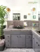 master bath with gray tile, cabinetry and black sink