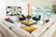 orange Malm blue velvety side chairs and neutral sectional in 1957 ranch living room