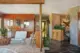 natural stone floor built in planter snake plants and modern furnishings in entryway of 1971 Oregon ranch home