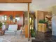 natural stone floor built in planter snake plants and modern furnishings in entryway of 1971 Oregon ranch home