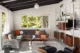 living room with sectional sofa, Eames lounge chair and omni unit in Pacific Northwest home