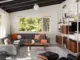 living room with sectional sofa, Eames lounge chair and omni unit in Pacific Northwest home