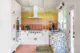 1956 kitchen renovation in LA home with colorful backsplash tile, terrazzo counters and pink tile floors