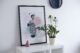 framed art small vase and zz plant create a balanced modern vignette