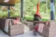 outdoor Malm and conversation area in covered porch in restored Alcoa Care-Free Home