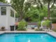 backyard pool with view to outdoor seating area in Kansas backyard