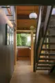 floating staircase leading up from kitchen in renovated Seattle home