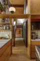 wood cabinetry and wall paneling in kitchen of renovated 1958 Seattle home