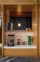 coffee bar with marble countertop and rectangular backsplash tile