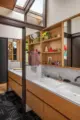 skylights and built in open shelving in bathroom of renovated 1958 Seattle home