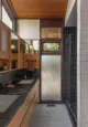 black and white marble countertops in bathroom with rectangular tile for floor and walls