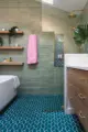 shower soaking tub built-in wood shelves and wooden vanity in renovated Seattle bathroom