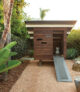 modern shed playhouse in backyard