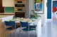 renovated kitchen in 1962 Palmer and Krisel home with multi-colored dishware and double oven