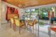 collection of orange Blenko glass in dining room credenza