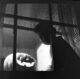 boy staring out of window with Jack o Lantern in 1950