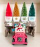 Pyrex bowls with coordinating bottlebrush trees and snowmen in toy pink Jeep