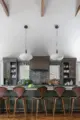 vaulted ceiling and spacious bar seating in renovated and expanded modern kitchen