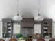 vaulted ceiling and spacious bar seating in renovated and expanded modern kitchen