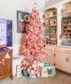 pink Christmas tree in home with mid century collectibles