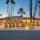 desert MCM home with stone accents and recessed entry