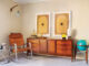 sitting area with MCM dresser and chrome and leather chair